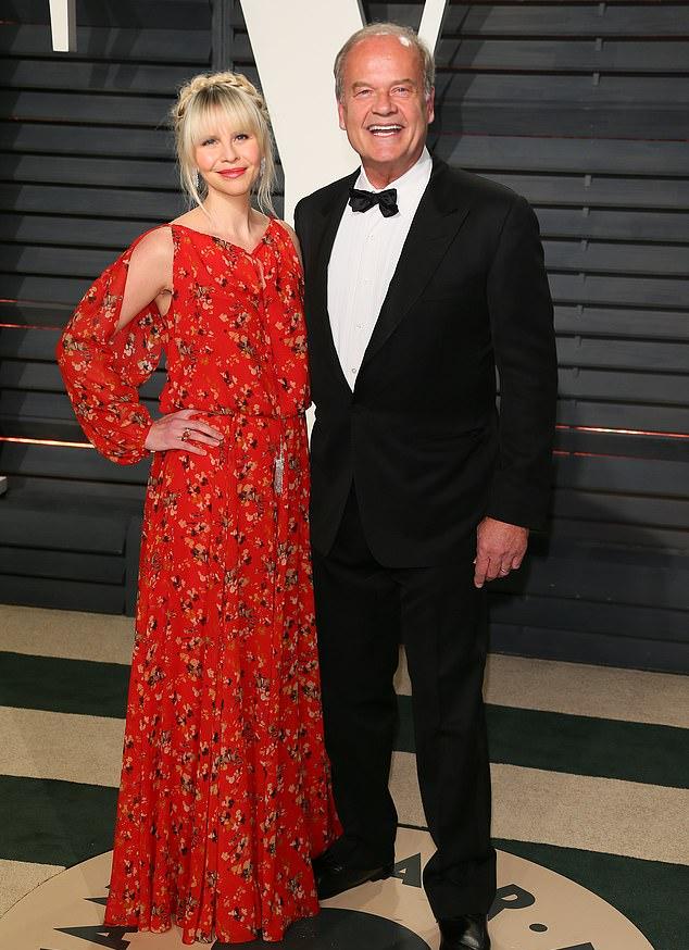 Ранее он объявил о рождении их ребенка в конце октября. На фото с женой Кейт Уолш (февраль 2017).