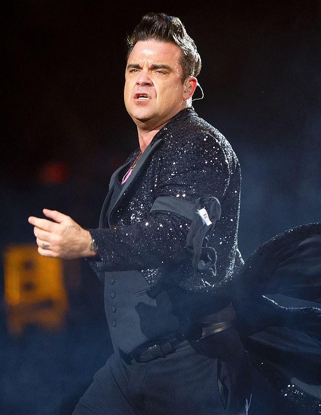 Робби два года назад признался, что сбросил два стоуна веса с помощью "чего-то вроде Оземпика" (фото 2013).