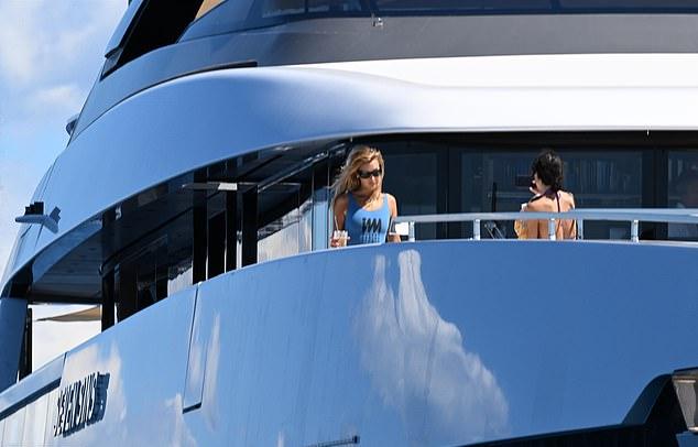 Bella Hadidshowcased her jaw-dropping figure in a blue swimsuit as she soaked up the sun on a yacht in France on Monday