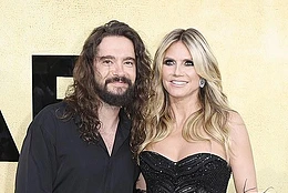Heidi Klumturned up the heat while posing topless on the beach on Wednesday
